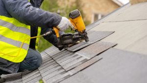 Roofer,Worker,In,Special,Protective,Work,Wear,And,Gloves,,Using